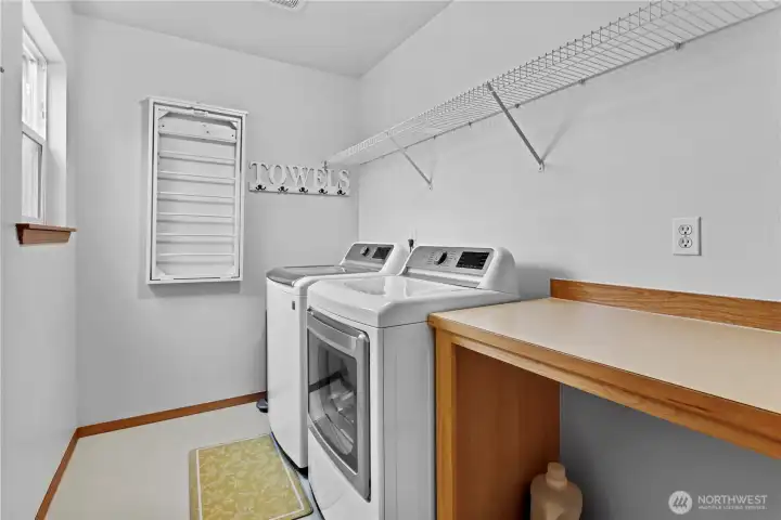 Large Laundry room with shelving