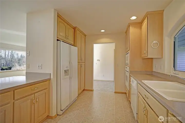 View from the kitchen leading to the laundry room and garage.