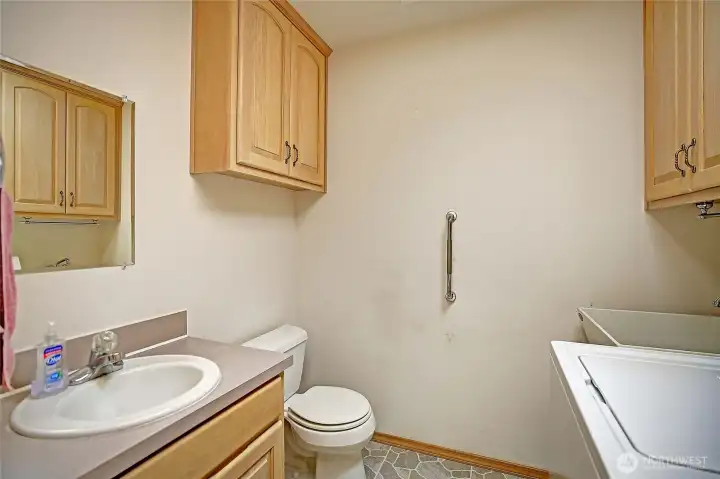 Guest bathroom connected to the laundry room