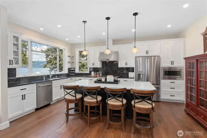 Kitchen with stainless steel appliances and gas stove.