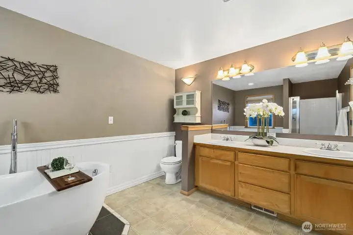Primary bathroom with soaking tub and shower.