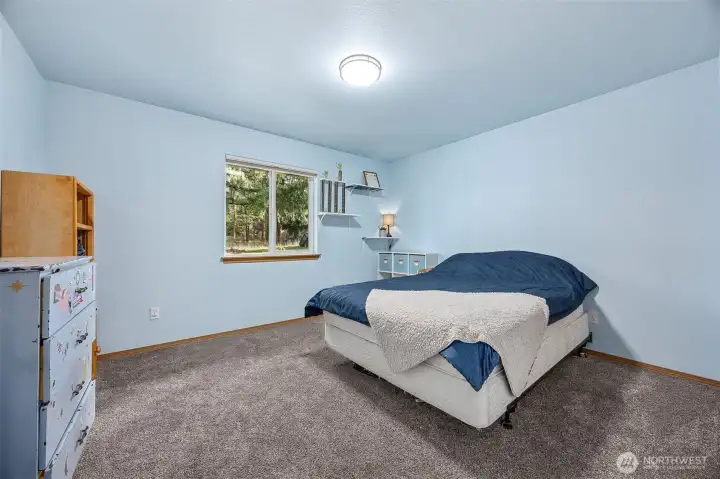 Large bedroom to the left of the bathroom