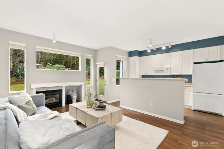 More natural light + cozy gas fireplace.