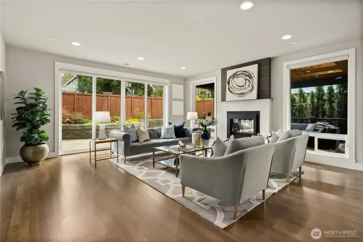 Spacious living room seamlessly connected to a fully fenced backyard