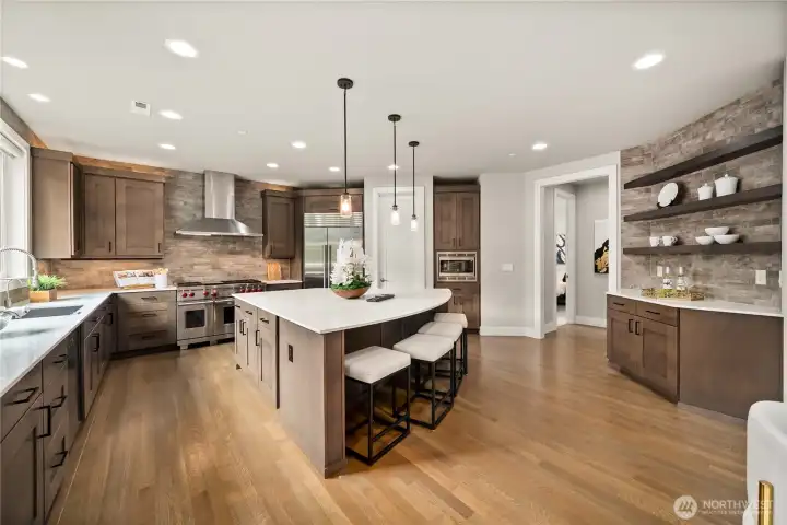 Stunning chef’s kitchen featuring an oversized island and premium appliances