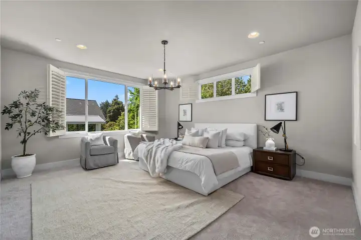 Expansive primary suite with a spa-inspired bath and walk-in closets