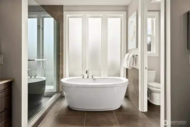 Elegant freestanding tub next to a shower, creating a spa-like retreat
