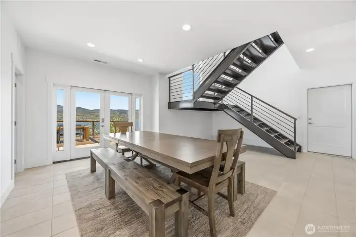 Dining with access to front deck and patio