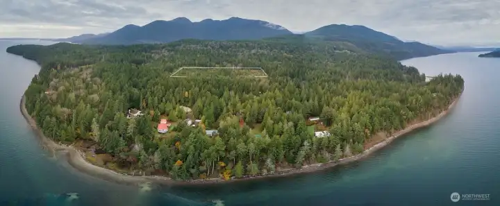 Wonderful, treed acreage. Just a short distance from the Hood Canal. Pt Whitney boat launch and beach is shown to the left.