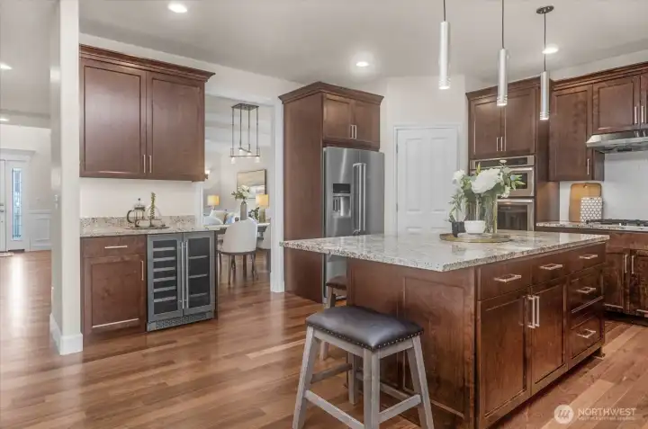 The updated kitchen is extraordinary.  Custom Acorn cabinets, a beverage center, walk-in pantry and much more make this the heart of the home.