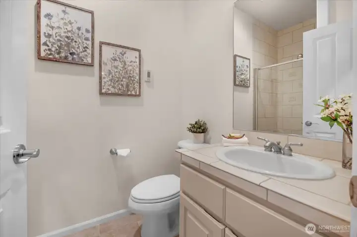 The main floor bath features a convenient shower, which is an exceptional plus if the main floor 4th bedroom is utilized.