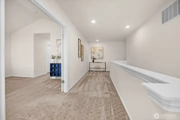 The upstairs hall area is large enough for bookshelves or a seating area.