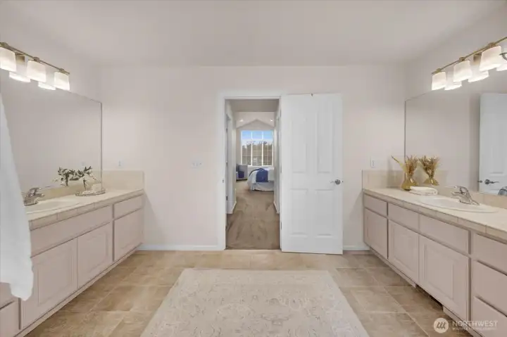 The bath features dual vanities.
