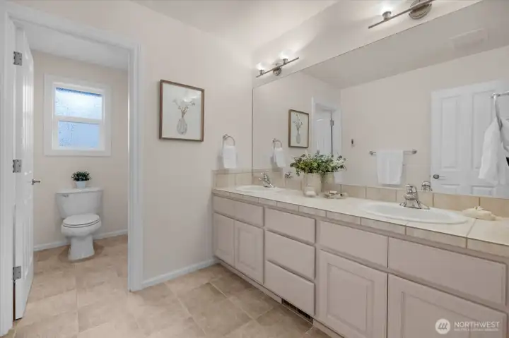 The second bath upstairs is large.  Radiant floors in all bath and utility room.