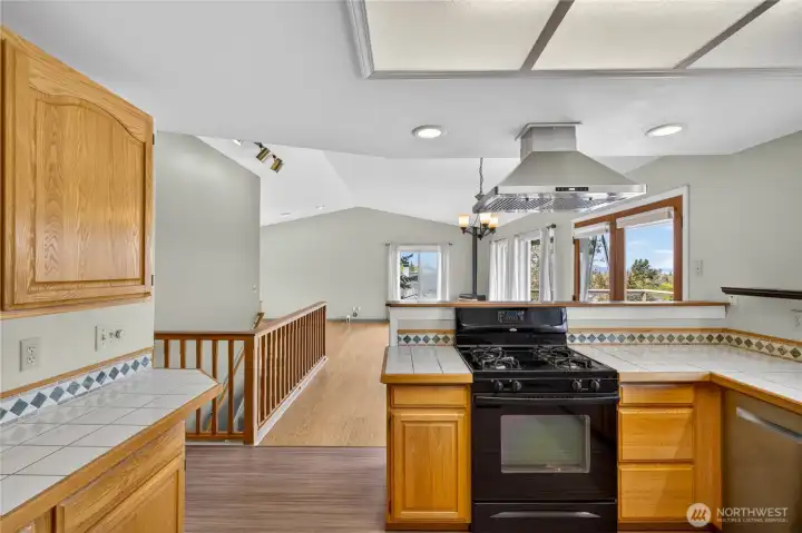 The open concept with kitchen, dining & living all in one space, leading to your deck!