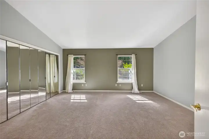 The serene primary main level bedroom.