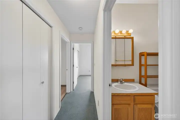 Down the hall to bath, bedroom and craft room.