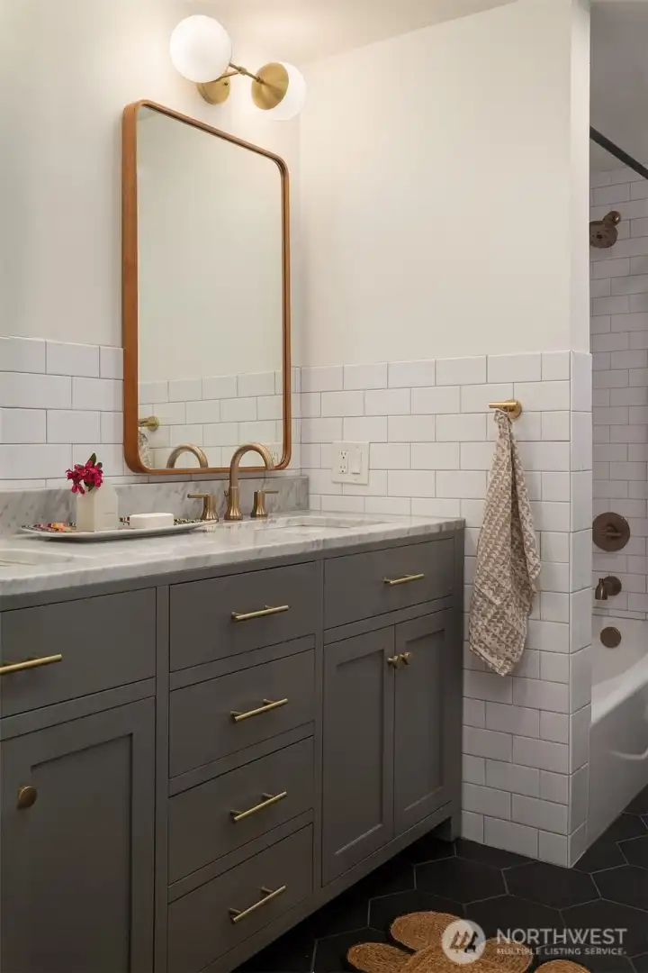 Super cool with double sinks, handsome storage and custom tile work.