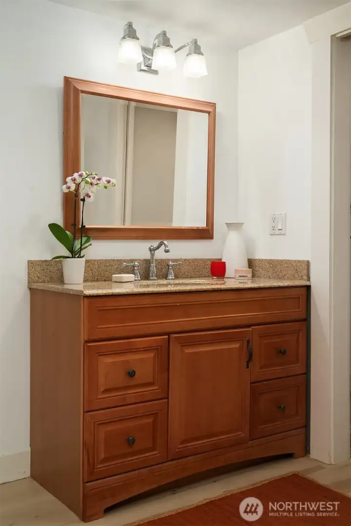 Full bathroom and laundry room just through the door.  Stackable laundry upstairs and full size laundry downstairs.