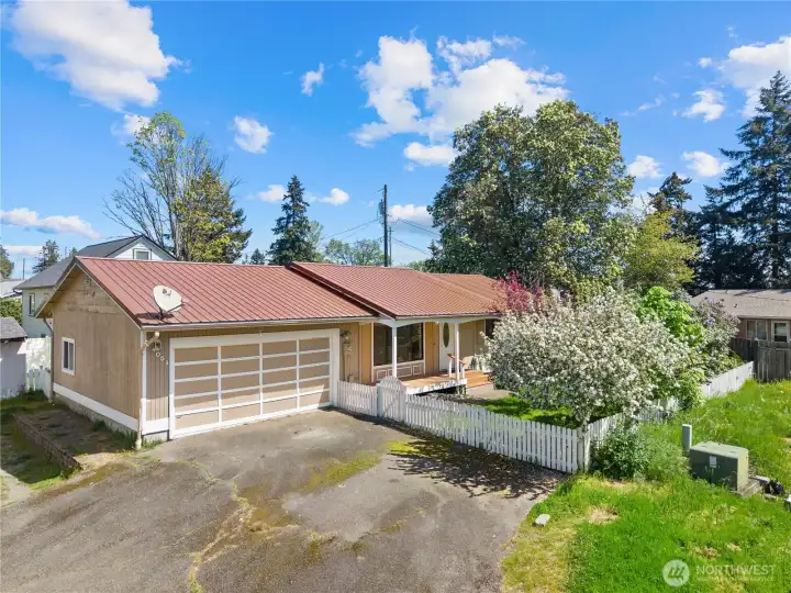 Front of home with two driveways!