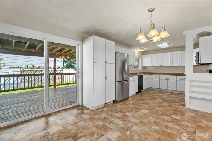 Large updated kitchen with stainless steel appliances.
