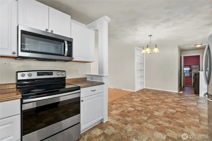 Large updated kitchen with stainless steel appliances.
