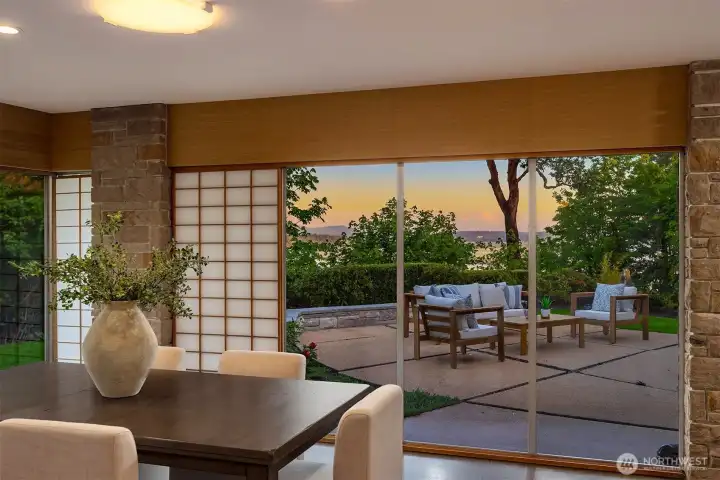 The Formal Dining room with a glimpse of the views to come. This photo was taken prior to some of the trees branches being trimmed