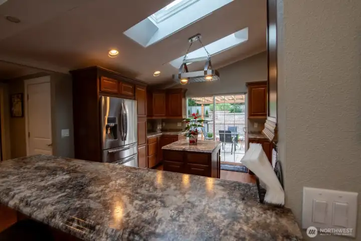 Kitchen with sliding door to backyard and pantry door to the left Kitchen with sliding door to backyard and pantry door to the left