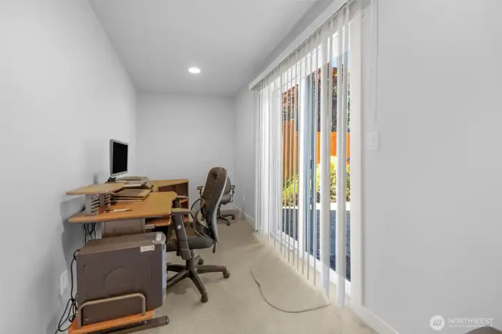Flex space on lower level by the fully fenced patio