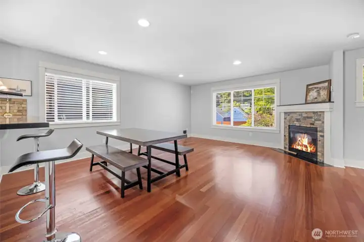 Dining flows into the living room with a gas fireplace