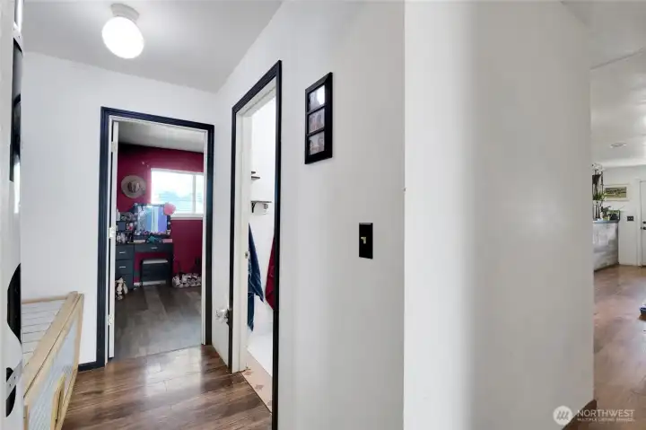 Hall way to bedroom number one with bathroom number one to the right. Hall way to bedroom number one with bathroom number one to the right.