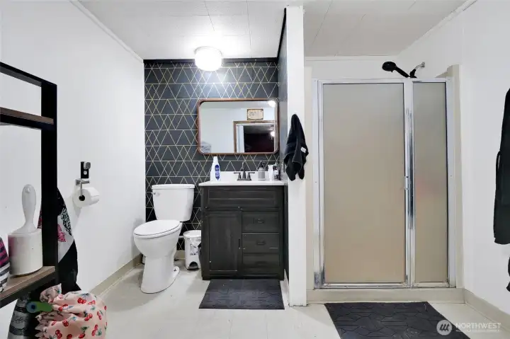 Large primary bathroom suite with walk in shower. Large primary bathroom suite with walk in shower.