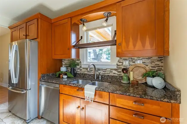 Wood cabinetry and granite countertops.