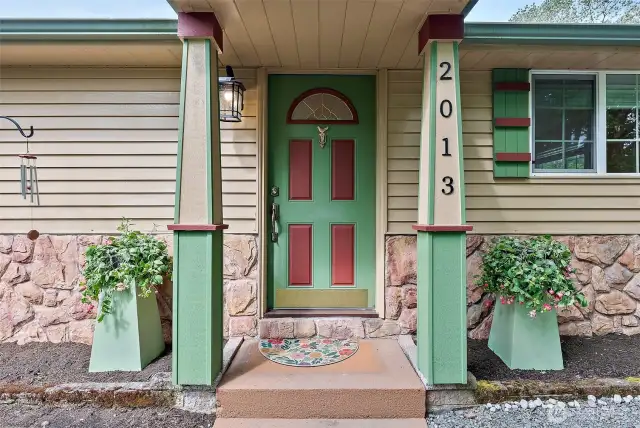You’ll find an embracing welcome in the details—each pillar and bloom hinting at the comfort inside and outside.