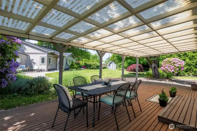 Main house has a LARGE covered deck right off the kitchen and living room. Offers views of the fully fenced gorgeous back yard. Go out to the garden to cook with home grown vegetables and fruit.