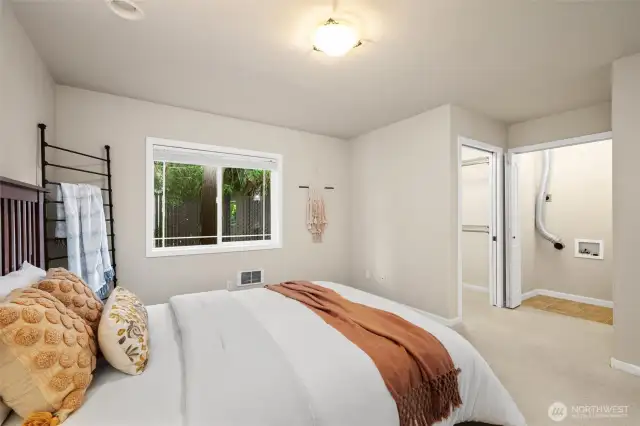 Guest house/ADU bedroom with view of laundry connection and closet