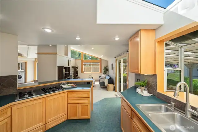 Main house kitchen with natural light and open layout