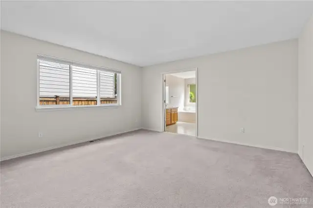 Primary Bedroom with Large Window allows plenty of light in! Blinds are included!