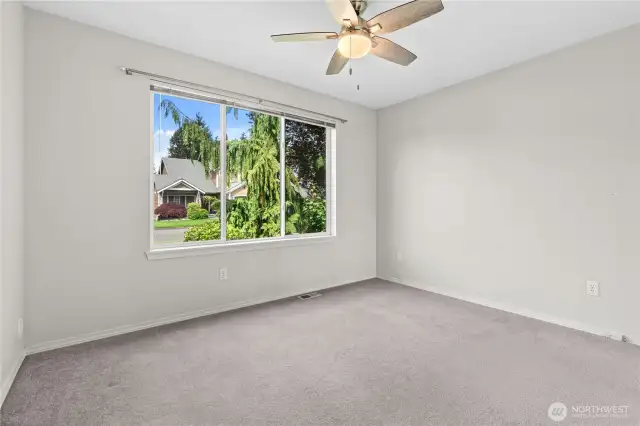 Bedroom #2 w/Ceiling Fan overlooking front yard.