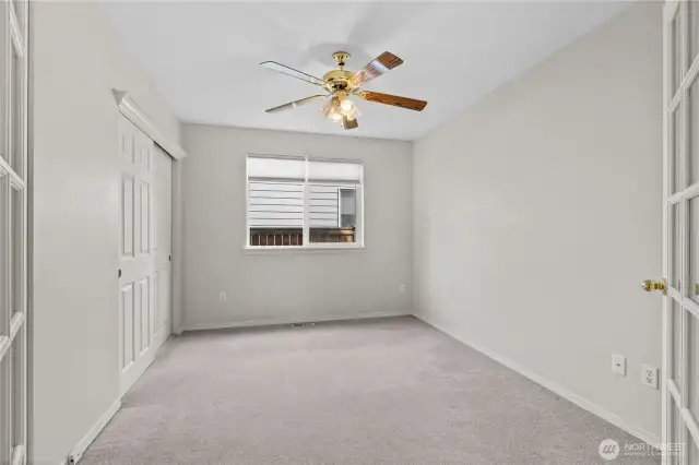 Bedroom #3. Seller has solid doors in garage, should buyer wish to change them from the glass doors.