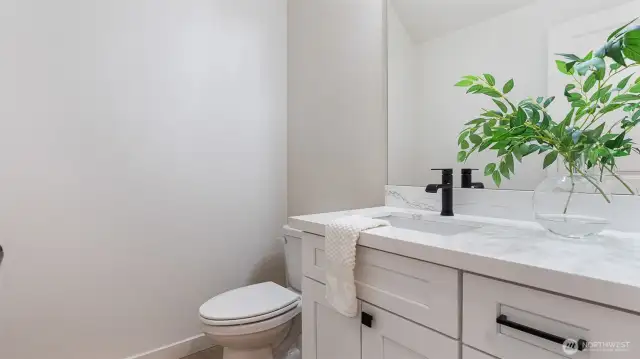 Powder Room has quartz counters, and undermount sink.