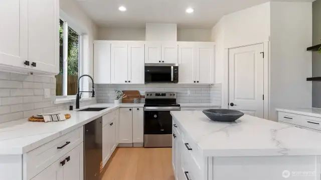 Kitchen has stainless appliances.