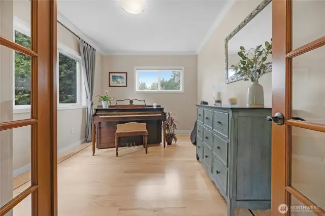 The main floor bedroom with french doors can have many uses.