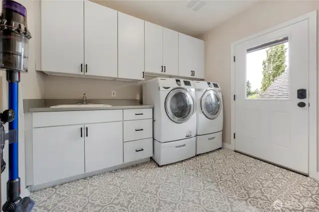 The laundry room is expansive.   It is also where the generator panel is kept.