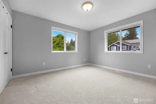 The fourth bedroom.  Each bedroom is on a corner and has light and bright windows.