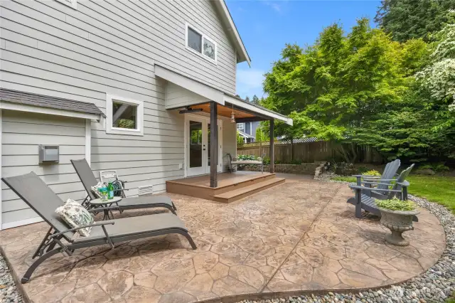 A beautiful stamped concrete deck is a showpiece in the backyard.