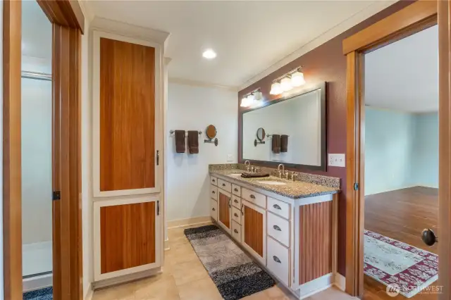 Bathroom cabinet matching styling in kitchen & 2 sinks.