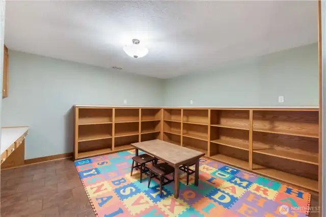 Game room with storage room for books & built in study desks on the left