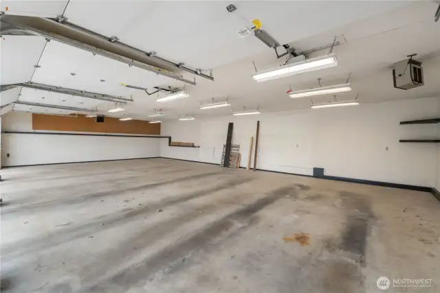 Inside 4 car garage with heater showing top right.