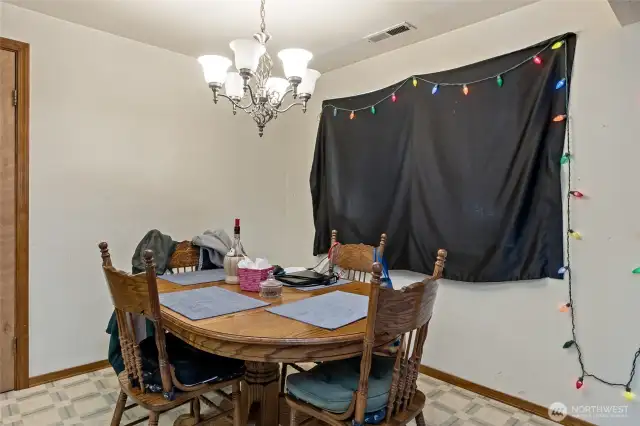 Dinning room showing door to utility room, work room and garage